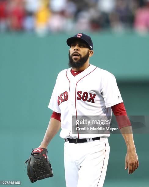 David Price of the Boston Red Sox reacts after Teoscar Hernandez of the Toronto Blue Jays hit a two run home run during the first inning at Fenway...