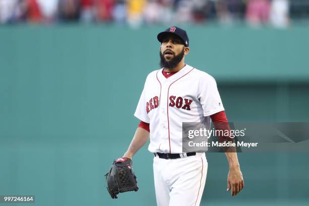 David Price of the Boston Red Sox reacts after Teoscar Hernandez of the Toronto Blue Jays hit a two run home run during the first inning at Fenway...