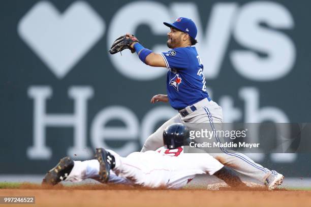 Jackie Bradley Jr. #19 of the Boston Red Sox steals second past Devon Travis of the Toronto Blue Jays during the third inning at Fenway Park on July...