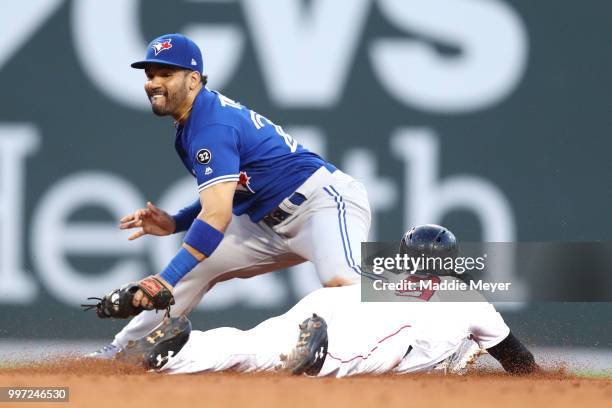 Jackie Bradley Jr. #19 of the Boston Red Sox steals second past Devon Travis of the Toronto Blue Jays during the third inning at Fenway Park on July...