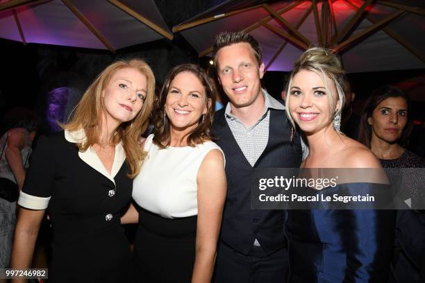 Dana Goldberg and David Ellison, Sandra Lynn Modic attend the cast reception following the global premiere of 'Mission: Impossible - Fallout' at Cafe...