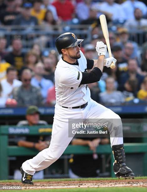 Jordy Mercer of the Pittsburgh Pirates hits an RBI single to left field in the fourth inning during the game against the Milwaukee Brewers at PNC...