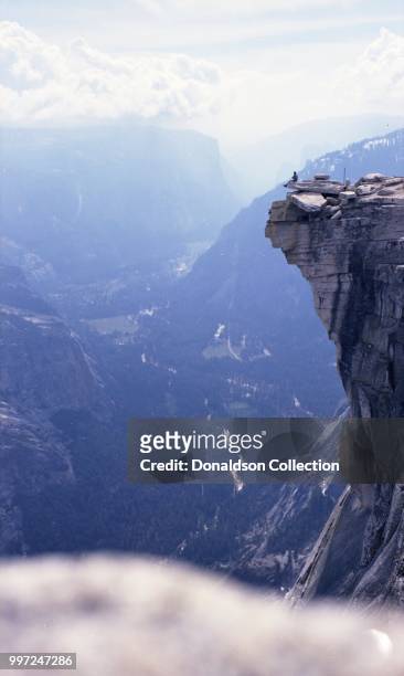 Jim Claus sitting on the promontory of Half Dome on May 6, 1972 in Yosemite National Park, California. Kodak 116 w 90mm Schneider lens.
