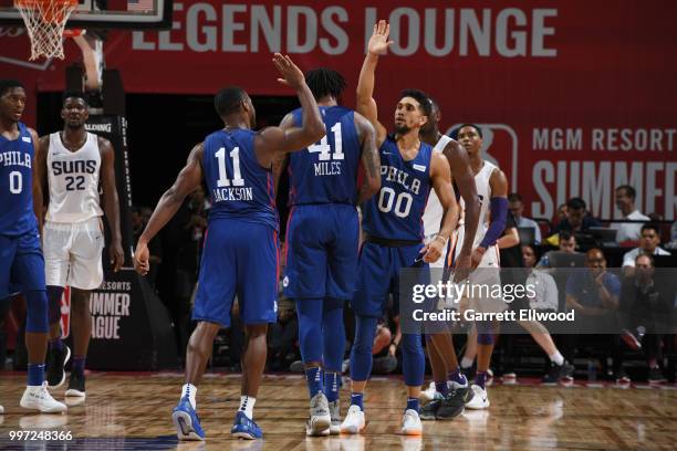 Demetrius Jackson and Askia Booker of the Philadelphia 76ers exchanges high fives against the Phoenix Suns during the 2018 Las Vegas Summer League on...