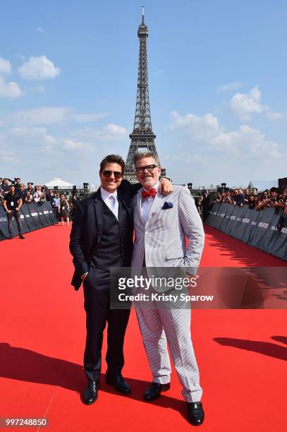 Tom Cruise and Director Christopher McQuarrie attend the Global Premiere of 'Mission: Impossible - Fallout' at Palais de Chaillot on July 12, 2018 in...