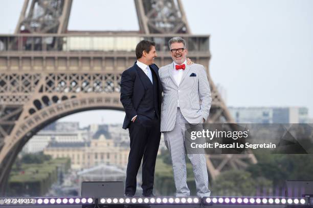 Tom Cruise and Director Christopher McQuarrie attend the Global Premiere of 'Mission: Impossible - Fallout' at Palais de Chaillot on July 12, 2018 in...