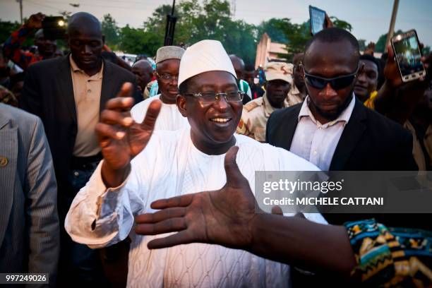 Malian opposition candidate for the presidential elections Soumaila Cisse greets supporters during a rally in Koulikoro on July 12, 2018. - Mali's...