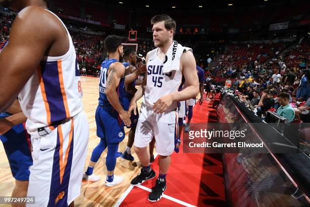 Jack Cooley of the Phoenix Suns exchanges handshakes with the the Philadelphia 76ers after the game during the 2018 Las Vegas Summer League on July...