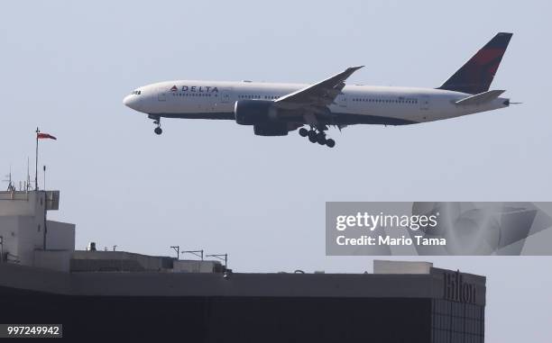 Delta Air Lines plane lands at Los Angeles International Airport on July 12, 2018 in Los Angeles, California. Delta announced today that it will...