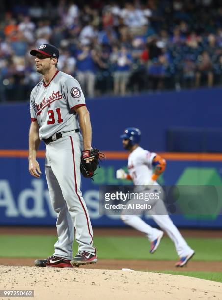 Jose Bautista of the New York Mets rounds the bases after hitting a home run against Max Scherzer of the Washington Nationals in the fourth inning...