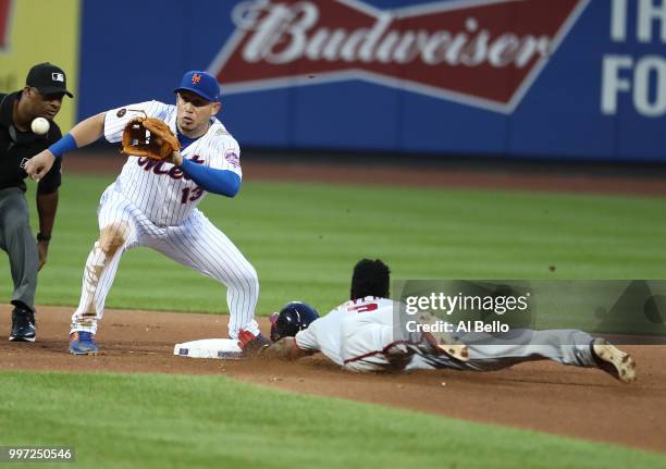 Michael Taylor of the Washington Nationals steals second base against Asdrubal Cabrera of the New York Mets during their game at Citi Field on July...