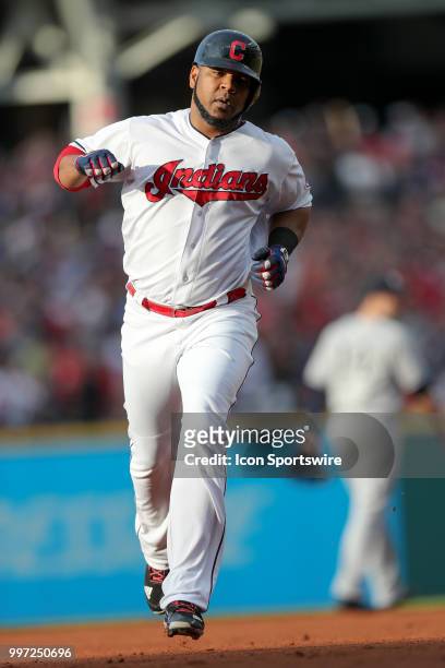 Cleveland Indians designated hitter Edwin Encarnacion rounds the bases after hitting a home run during the first inning of the Major League Baseball...
