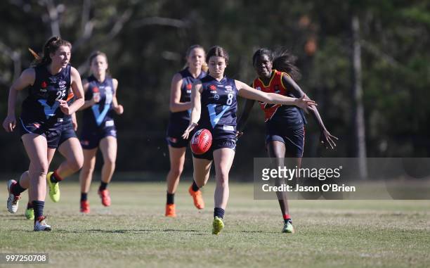 Vic Metro's Georgia Patrikios runs with the ball during the AFLW U18 Championships match between Vic Metro v Central Allies at Bond University on...