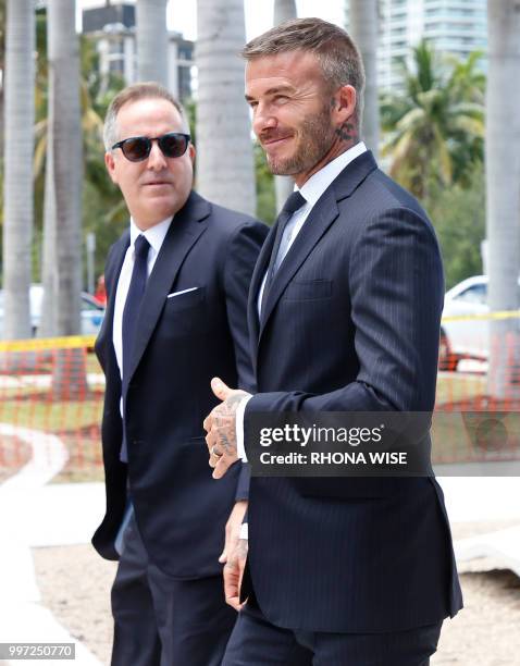 Jorge Mas and David Beckham arrive for a rally in support of building a Major League Soccer stadium on public land in Miami, Florida on July 12,...