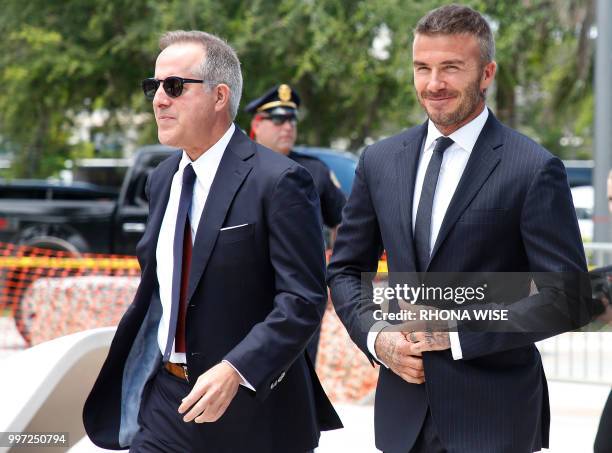 Jorge Mas and David Beckham arrive for a rally in support of building a Major League Soccer stadium on public land in Miami, Florida on July 12,...