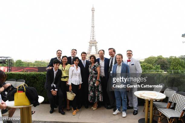 Tom Cruise and Director Christopher McQuarrie pose for a group picture with Mayor of the 7th arrondissement of Paris Rachida Dati during the Global...