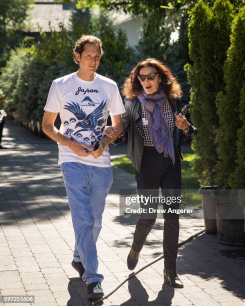 John Elkann, chairman of Fiat Chrysler Automobiles, walks with fashion designer Diane von Furstenberg at the annual Allen & Company Sun Valley...