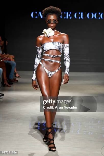 Model walks the runway for Candice Cuoco at Miami Swim Week powered by Art Hearts Fashion Swim/Resort 2018/19 at Faena Forum on July 12, 2018 in...