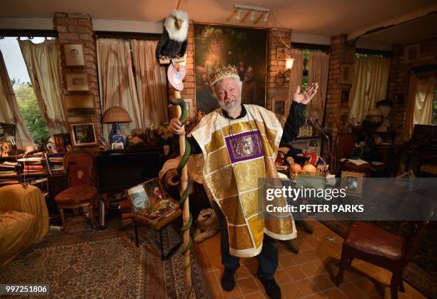 This photo taken on June 6, 2018 shows Paul Delprat gesturing at his home as the self-appointed Prince of the Principality of Wy, a micronation...