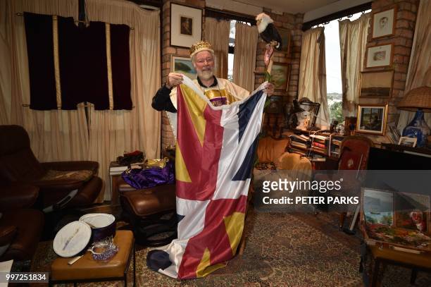 This photo taken on June 6, 2018 shows Paul Delprat displaying his own flag at his home as the self-appointed Prince of the Principality of Wy, a...