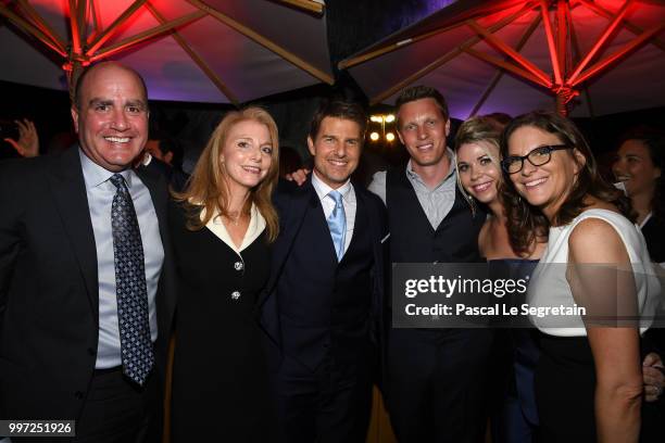 Don Granger, a guest, Tom Cruise, David Ellison, Sandra Lynn Modic and Dana Goldberg attend the cast reception following the global premiere of...