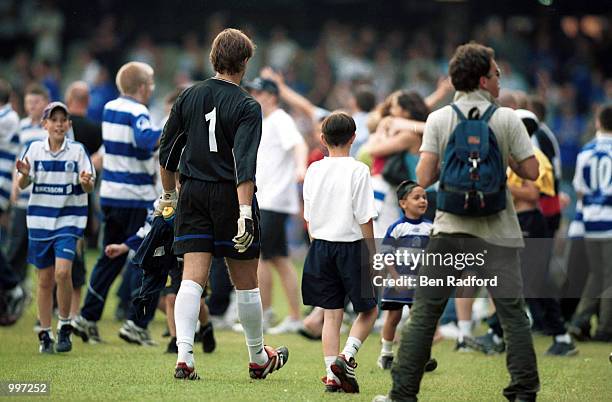 Mark Bosnich of Chelsea head back to the changing rooms as fans run on the pitch at the end of the match between Queens Park Rangers and Chelsea in a...