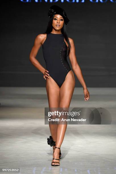 Model walks the runway for Candice Cuoco at Miami Swim Week powered by Art Hearts Fashion Swim/Resort 2018/19 at Faena Forum on July 12, 2018 in...