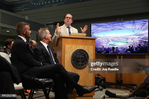 David Beckham and Jorge Mas listen as their architect Bernardo Fort-Brescia speaks during a pubic hearing at the Miami City Hall about building a...