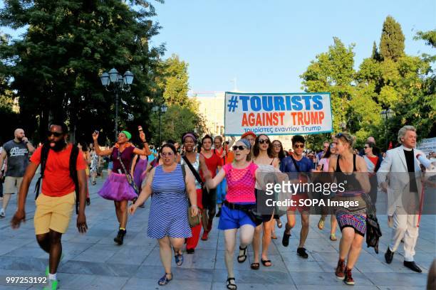 Women seen shouting slogans during the protest. Tourist have taken part in the demonstration named, Tourist against Trump in the capital city of...