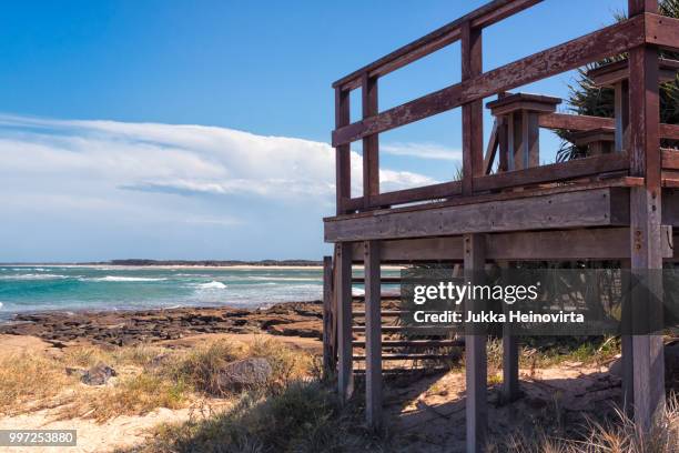 wooden stairs to the beach - heinovirta stockfoto's en -beelden