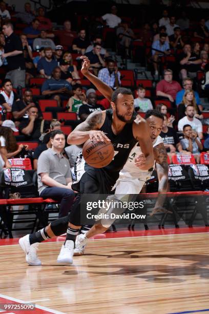 Trey McKinney-Jones of the San Antonio Spurs handles the ball against the Milwaukee Bucks during the 2018 Las Vegas Summer League on July 12, 2018 at...