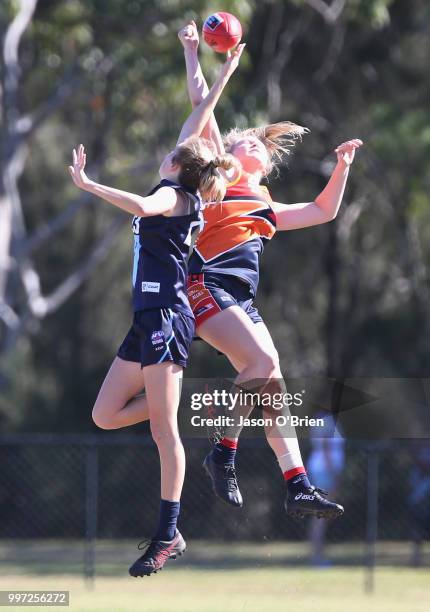 Central's Montana Mckinnon contests posession with Vic Metro's Sarah Kendall during the AFLW U18 Championships match between Vic Metro v Central...