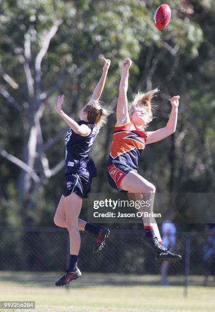 Central's Montana Mckinnon contests posession with Vic Metro's Sarah Kendall during the AFLW U18 Championships match between Vic Metro v Central...