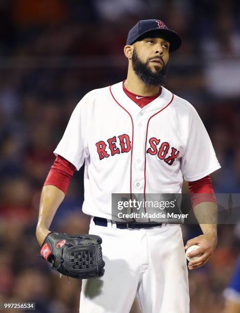 David Price of the Boston Red Sox reacts after Kendrys Morales of the Toronto Blue Jays hit a home run during the seventh inning at Fenway Park on...