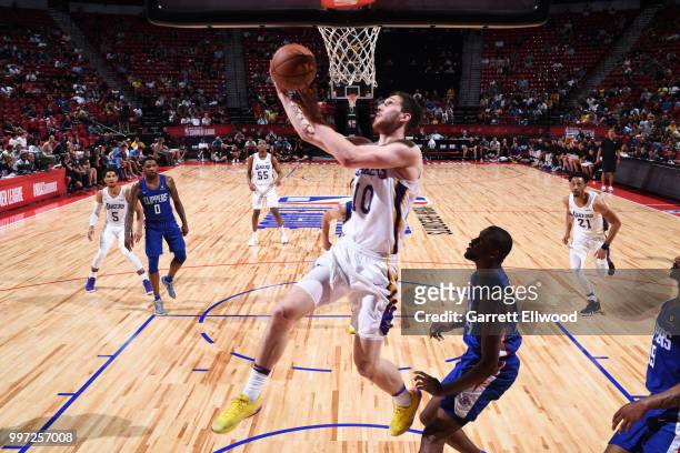 Svi Mykhailiuk of the Los Angeles Lakers goes to the basket against the LA Clippers during the 2018 Las Vegas Summer League on July 12, 2018 at the...