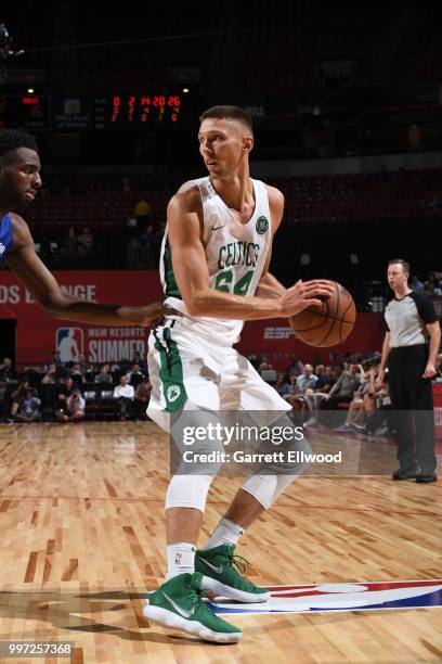 Jarrod Uthoff of the Boston Celtics handles the ball against the New York Knicks during the 2018 Las Vegas Summer League on July 12, 2018 at the...