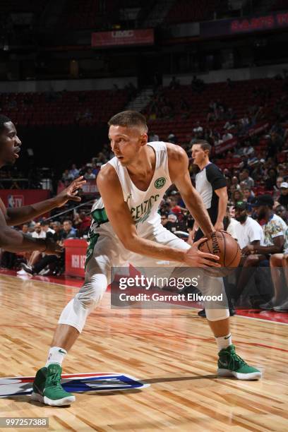 Jarrod Uthoff of the Boston Celtics handles the ball against the New York Knicks during the 2018 Las Vegas Summer League on July 12, 2018 at the...