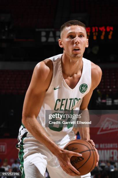 Jarrod Uthoff of the Boston Celtics handles the ball against the New York Knicks during the 2018 Las Vegas Summer League on July 12, 2018 at the...