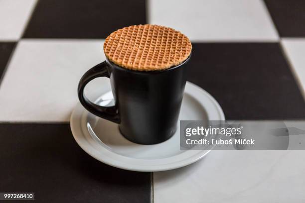 happy stroopwafel - stroopwafel stock pictures, royalty-free photos & images