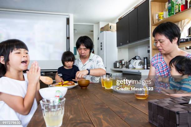 Five people of family just began to having lunch in a room