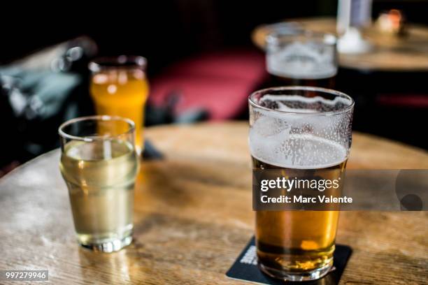 deserved pint - beer on table stock pictures, royalty-free photos & images