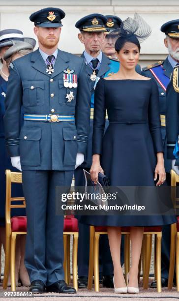 Prince Harry, Duke of Sussex and Meghan, Duchess of Sussex attend a ceremony to mark the centenary of the Royal Air Force on the forecourt of...