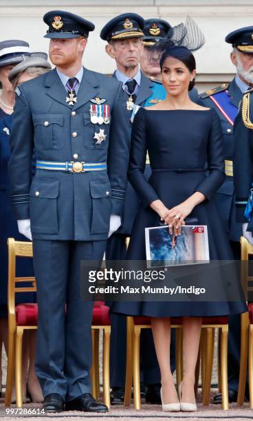 Prince Harry, Duke of Sussex and Meghan, Duchess of Sussex attend a ceremony to mark the centenary of the Royal Air Force on the forecourt of...