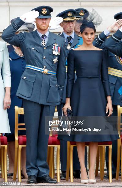 Prince Harry, Duke of Sussex and Meghan, Duchess of Sussex attend a ceremony to mark the centenary of the Royal Air Force on the forecourt of...