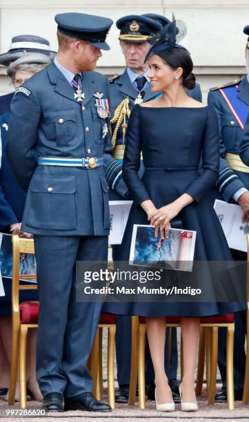 Prince Harry, Duke of Sussex and Meghan, Duchess of Sussex attend a ceremony to mark the centenary of the Royal Air Force on the forecourt of...