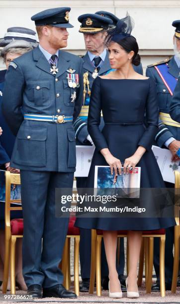 Prince Harry, Duke of Sussex and Meghan, Duchess of Sussex attend a ceremony to mark the centenary of the Royal Air Force on the forecourt of...