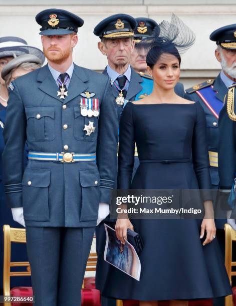 Prince Harry, Duke of Sussex and Meghan, Duchess of Sussex attend a ceremony to mark the centenary of the Royal Air Force on the forecourt of...