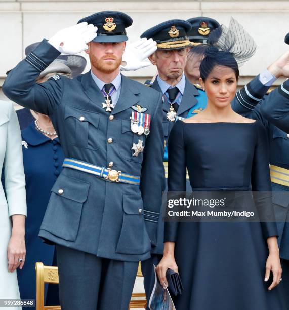 Prince Harry, Duke of Sussex and Meghan, Duchess of Sussex attend a ceremony to mark the centenary of the Royal Air Force on the forecourt of...