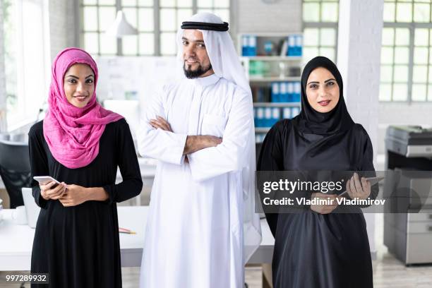 arab businesspeople in modern workplace - agal stock pictures, royalty-free photos & images