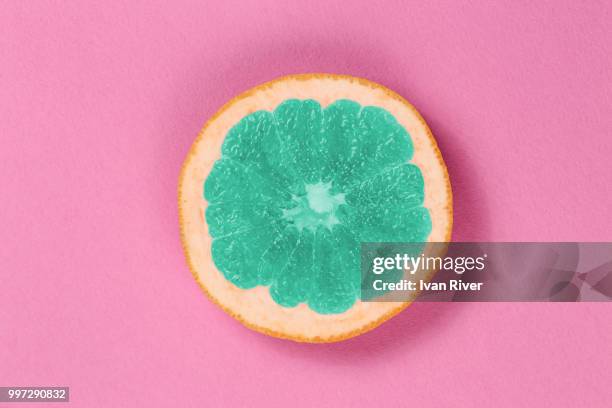 top view popart grapefruit green color on a pink background - pink grapefruit stock pictures, royalty-free photos & images